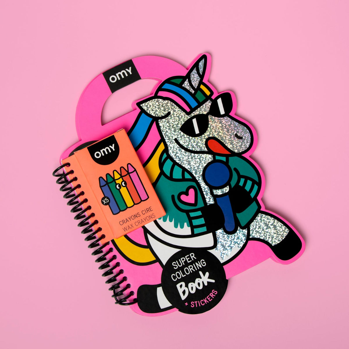 Colorful unicorn-shaped keychain with a coloring book and crayons on a pink background
