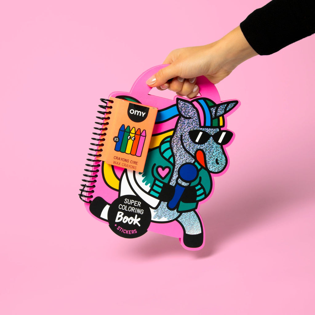 Coloring book and crayon set with a unicorn design on a pink background