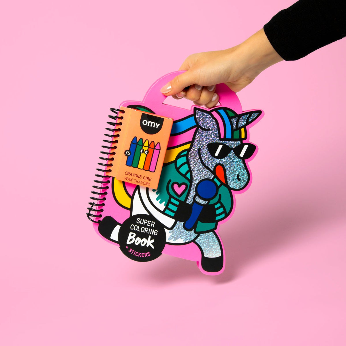 Coloring book and crayon set with a unicorn design on a pink background