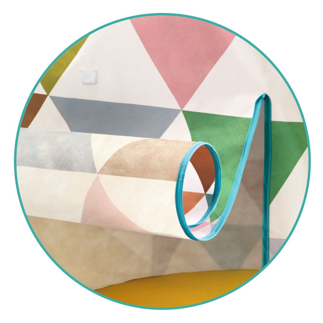 Close-up of the Djeco multi coloured play tent door, roll-up fabric flap tied back with a blue strap