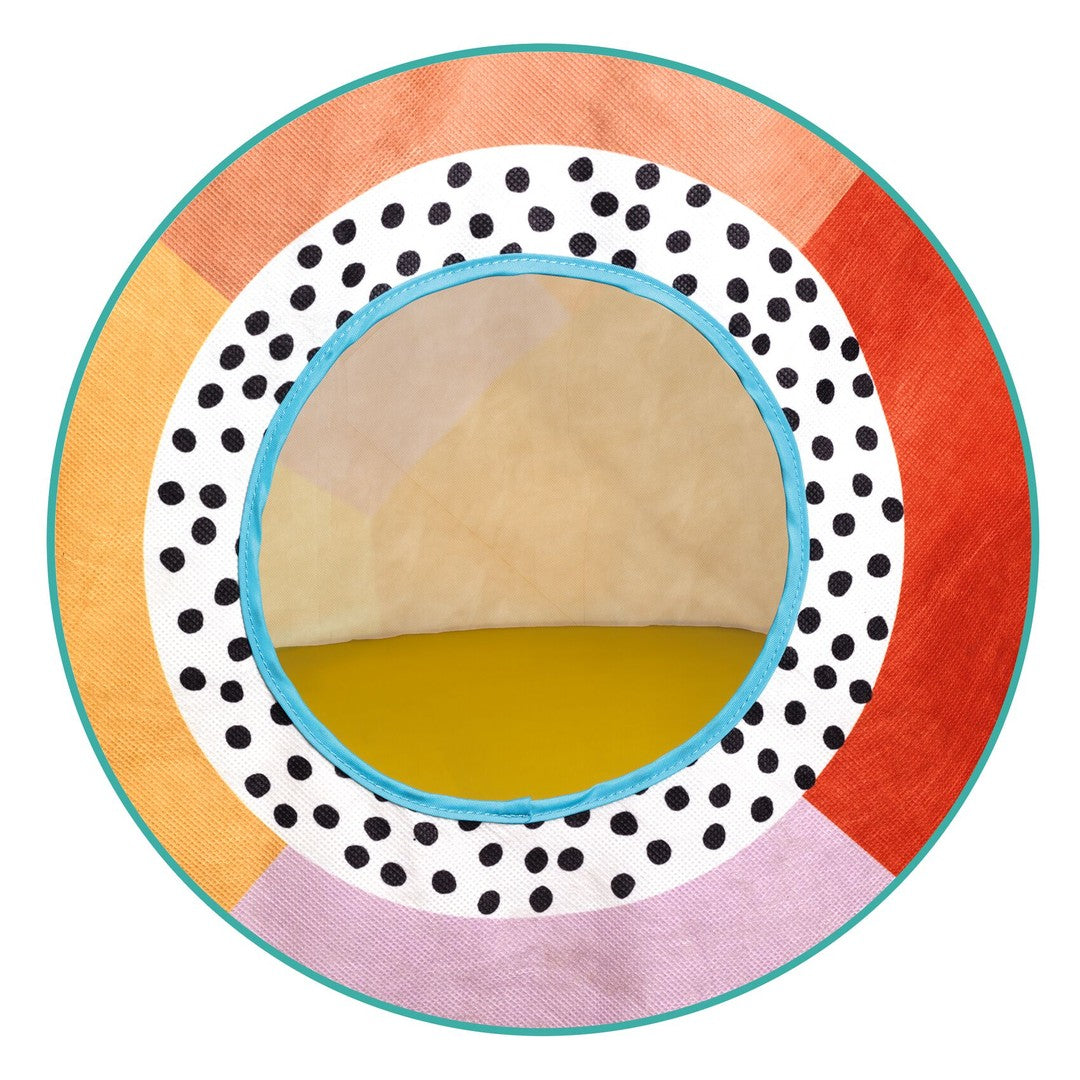 Round window of the Djeco multi coloured play tent with black and white spotted border and orange, pink and red rim