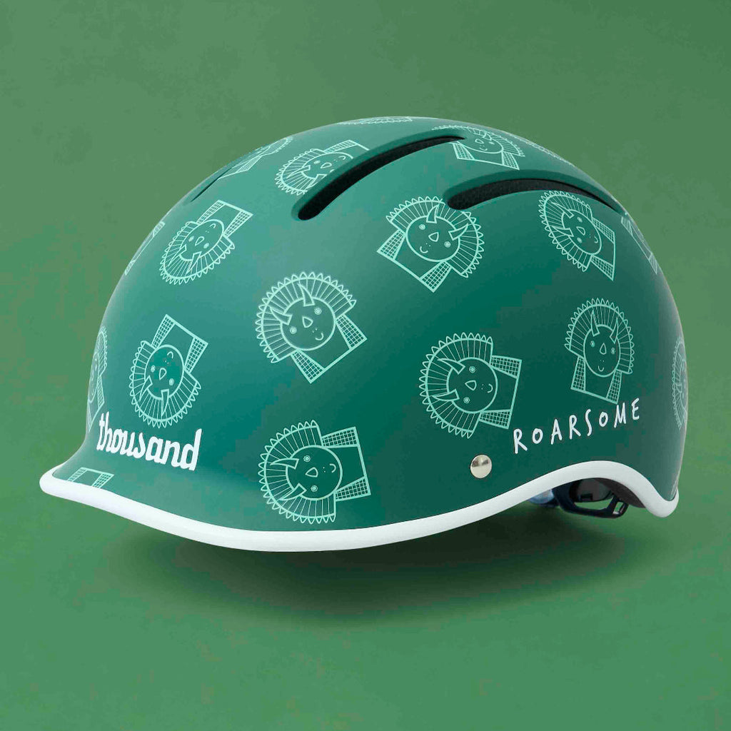 Green helmet with white designs and text on a green background