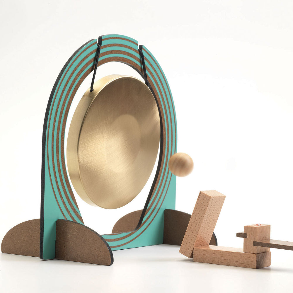 Decorative gong with wooden stand on a white background