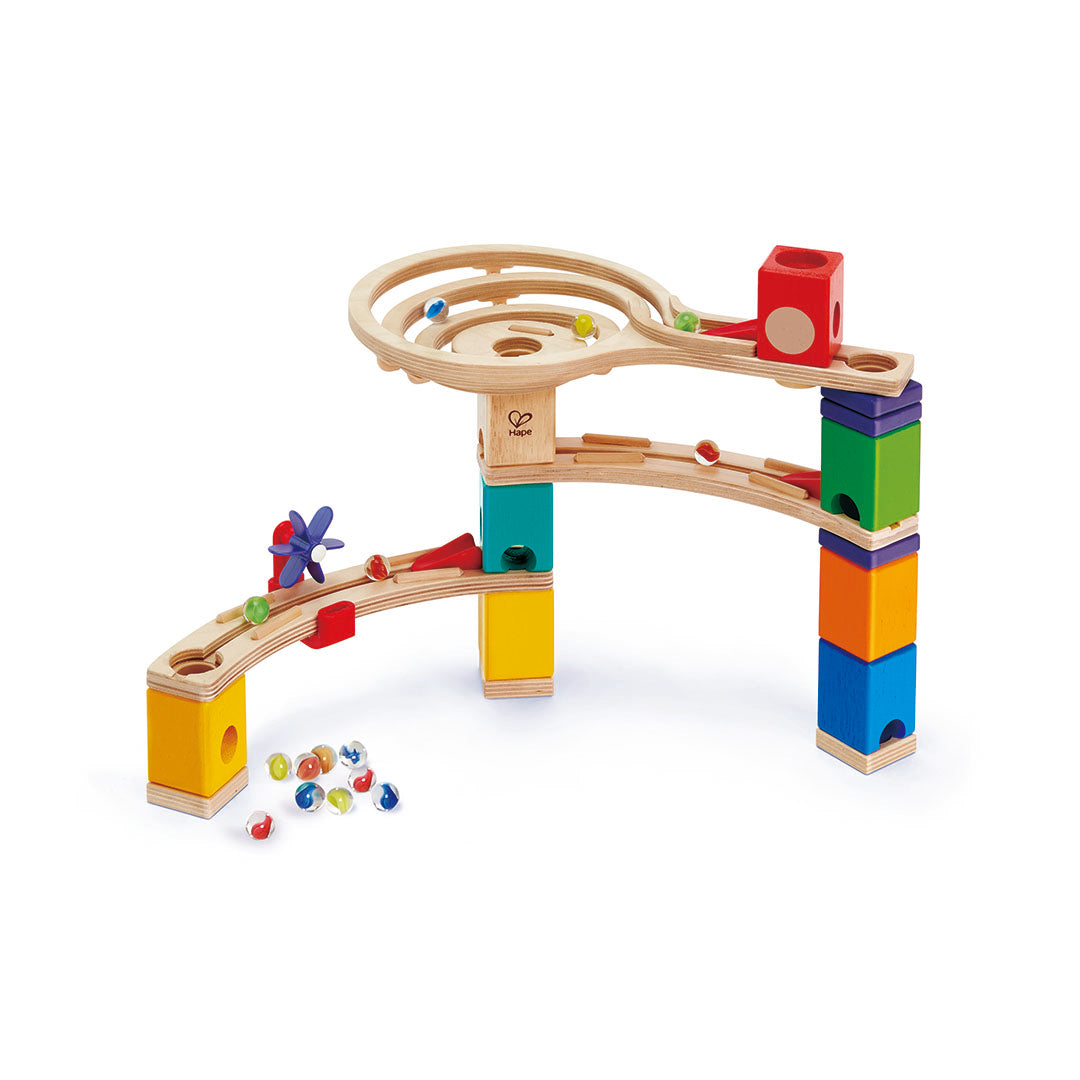 Colourful wooden marble run toy with moving parts on a white background
