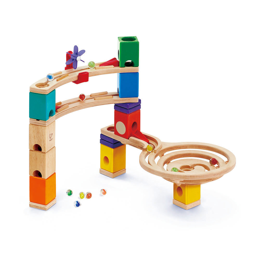 Colorful wooden marble run toy with various colored blocks on a white background