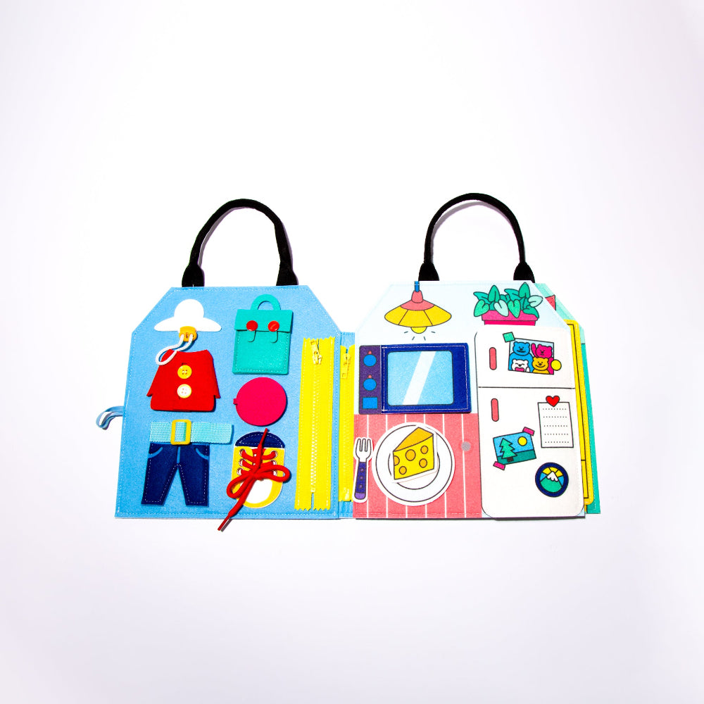 Colorful children's book with illustrations of a house, TV, and other objects on a white background