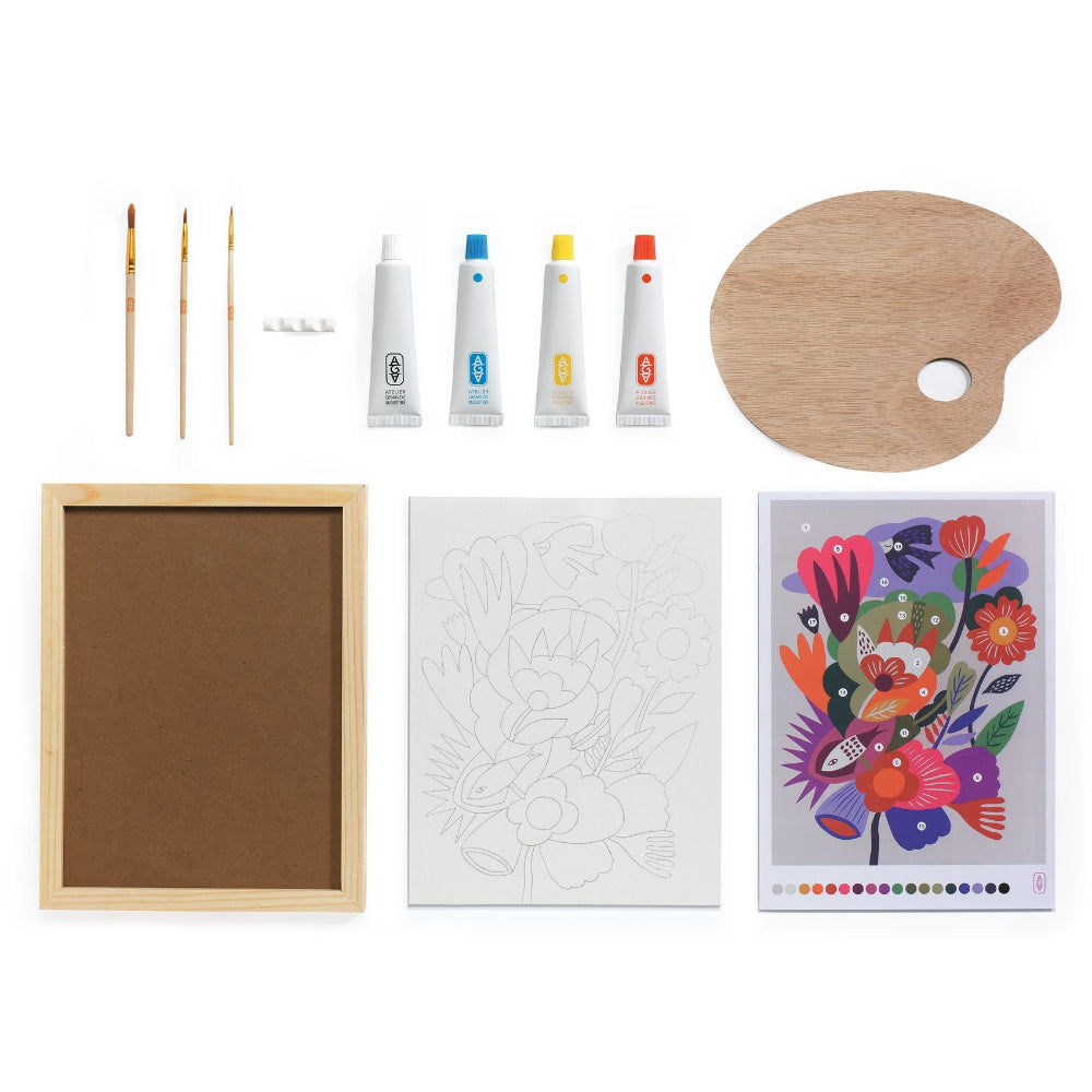 Art supplies including brushes, paint tubes, a palette, a framed canvas, and a coloring book on a white background.