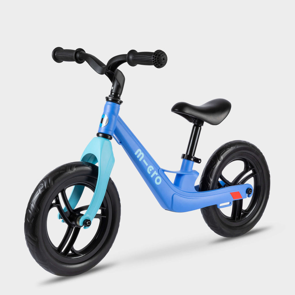 Micro Balance Bike Lite in blue with light blue fork and black wheels, side view