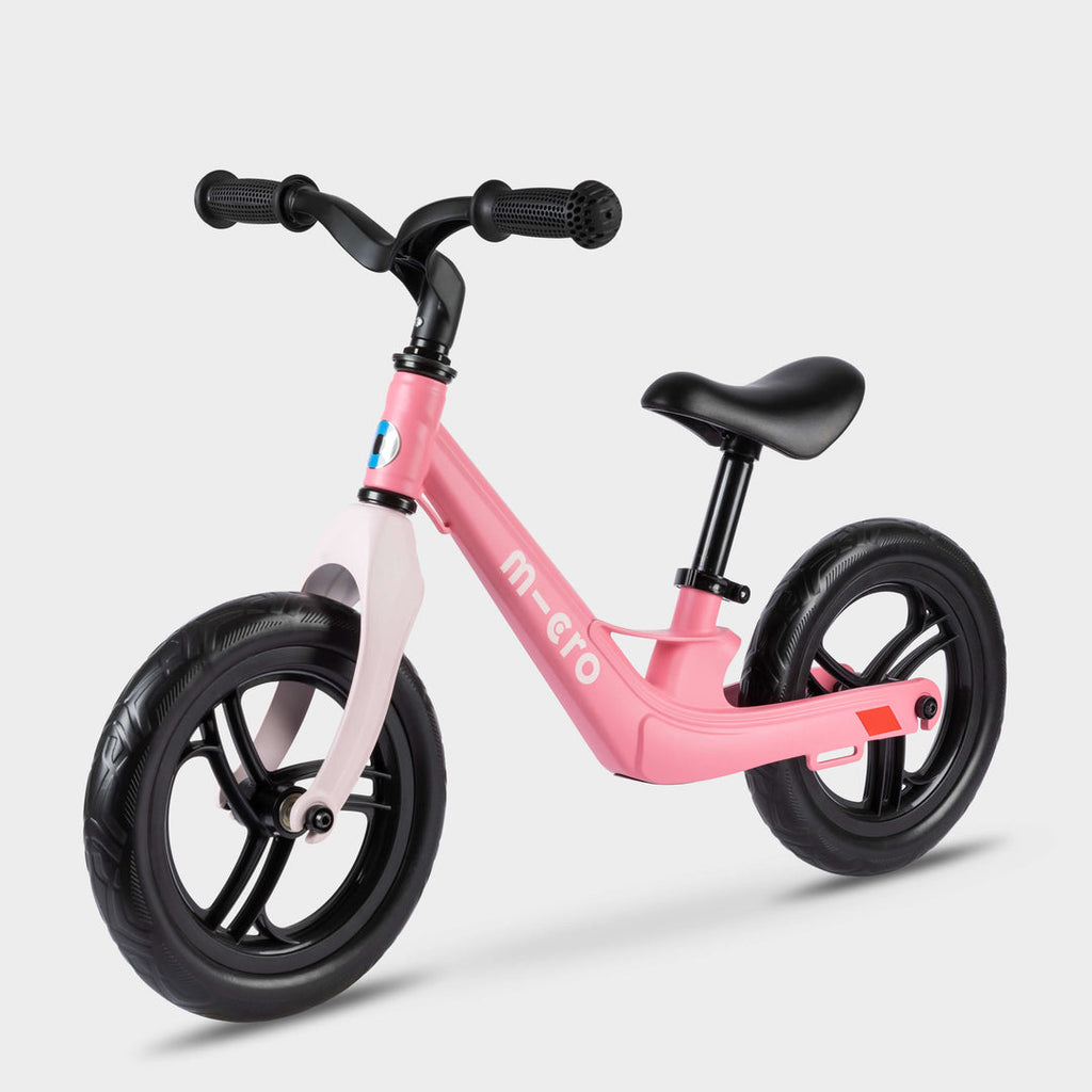 Micro Balance Bike Lite in pink with pale pink fork and black wheels, side view