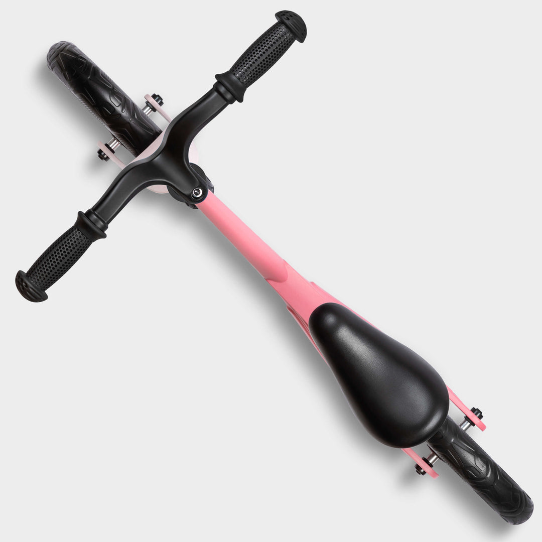 Top-down view of the pink Micro Balance Bike Lite showing the handlebar and saddle