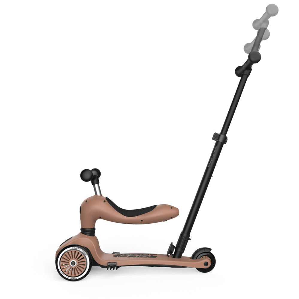 Children's scooter with a seat and extendable handlebar on a white background