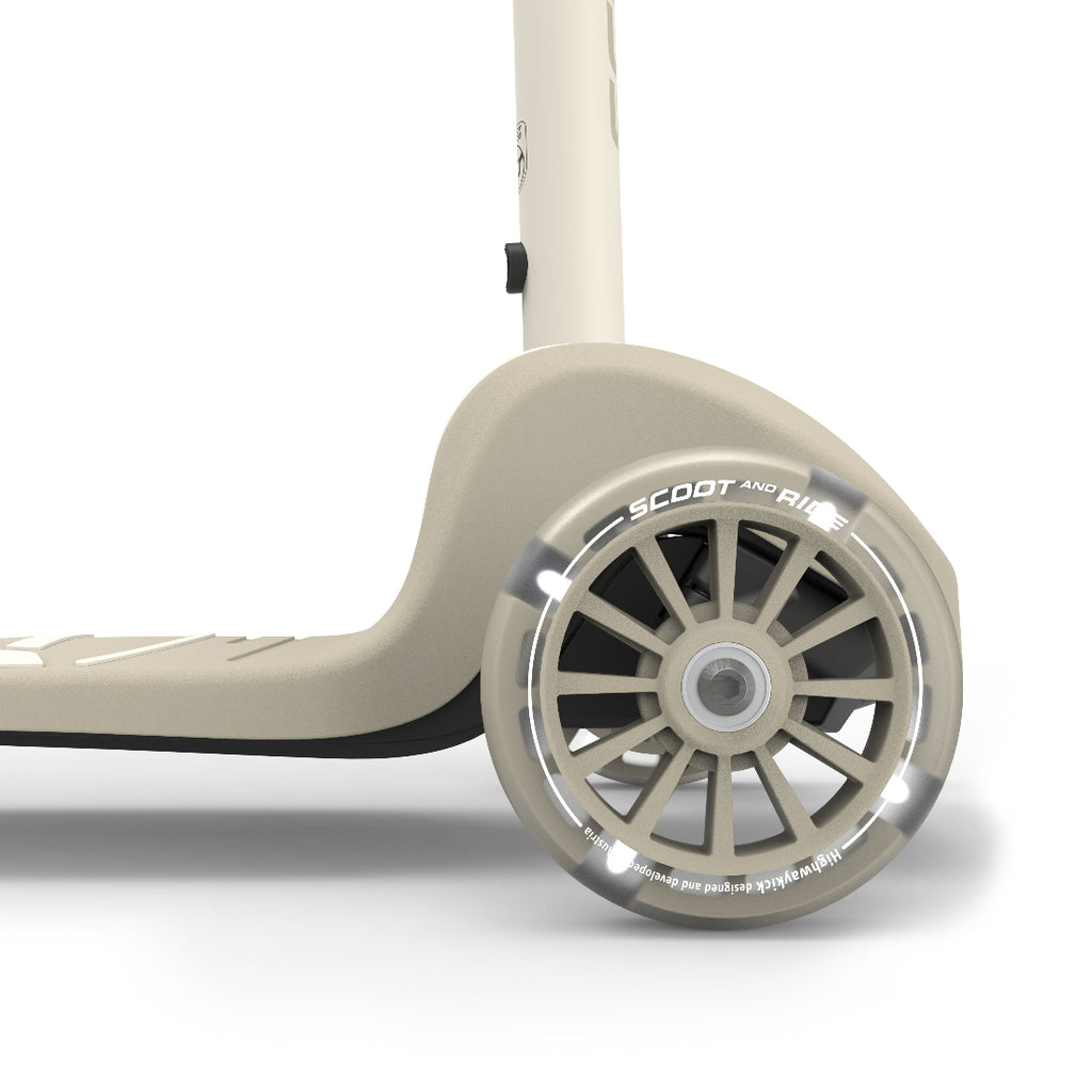 Close-up of a scooter wheel with 'Scoot and Ride' branding on a white background