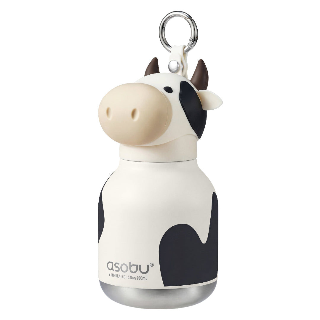 Cow-shaped water bottle with a keychain on a white background