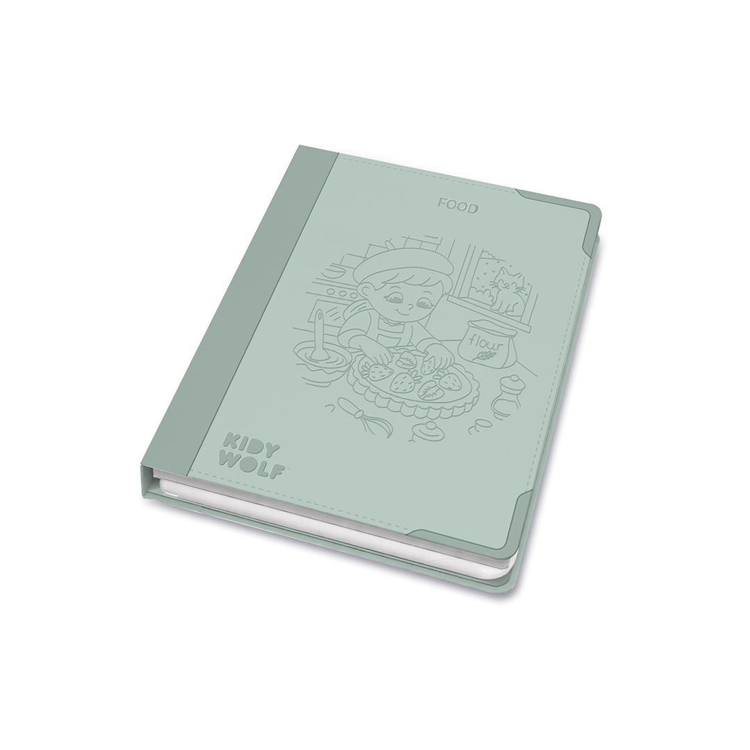 Light green notebook with embossed design and 'Koby Wolf' branding on a white background
