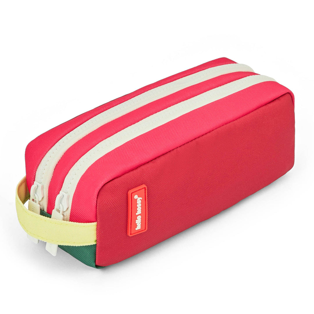 Red pencil case with white zipper on a white background