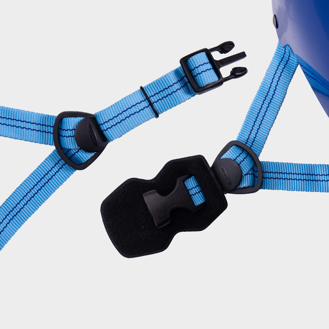 Close-up of the light blue adjustable straps and black buckle on the Micro plain helmet
