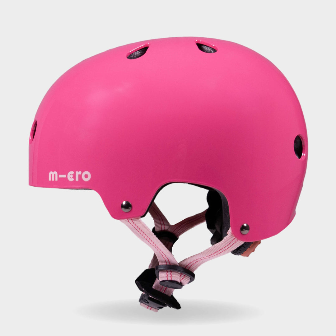 Side view of the pink Micro plain kids' helmet showing the air vents