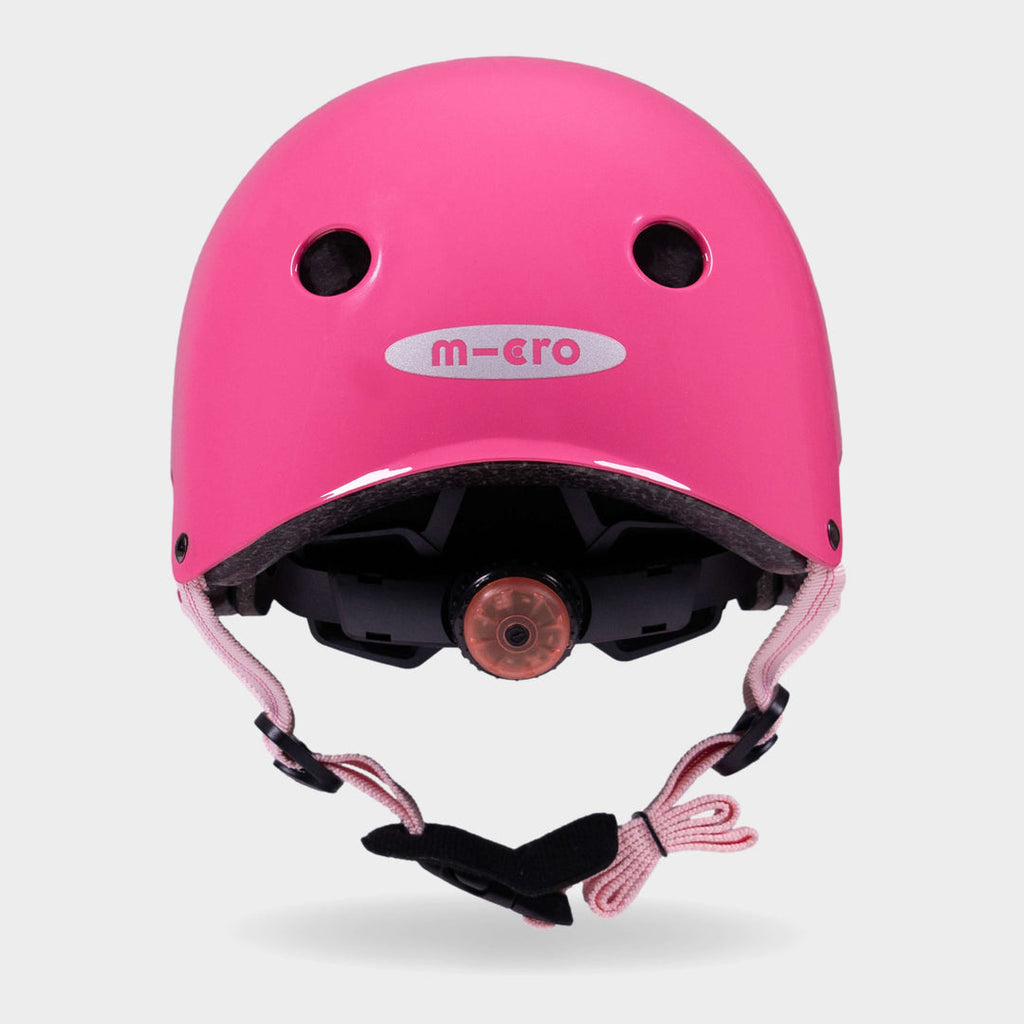 Back of the pink Micro plain helmet showing the rear light and micro logo