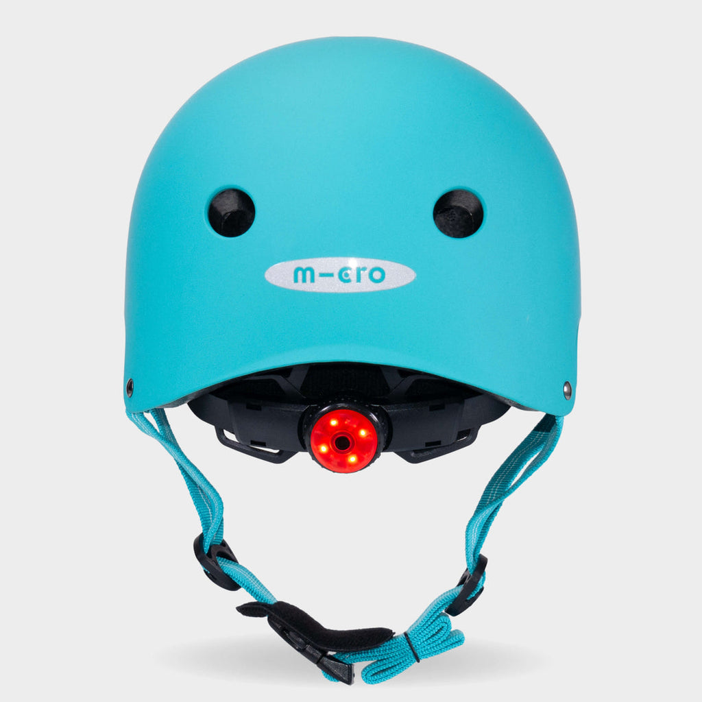 Back of the aqua Micro plain helmet with the red rear safety light switched on