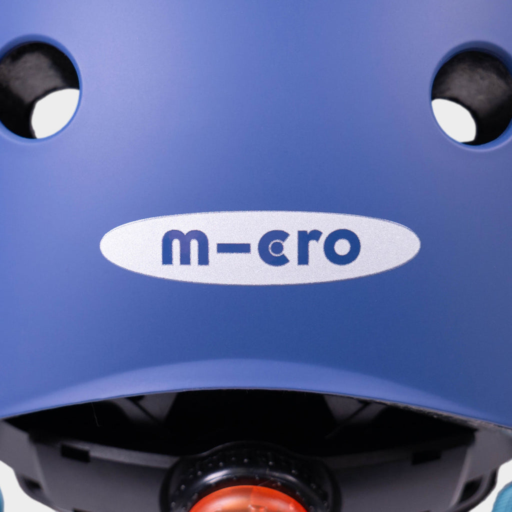 Close-up of the micro logo and rear light on the back of the navy helmet