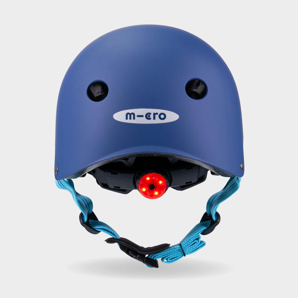 Back of the navy Micro plain helmet with the red rear safety light switched on