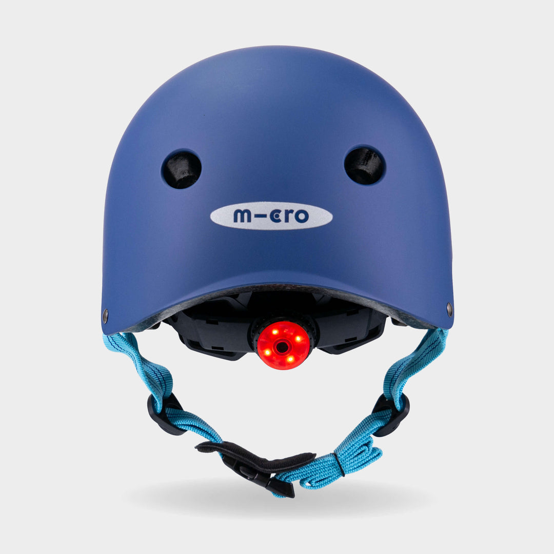 Back of the navy Micro plain helmet with the red rear safety light switched on