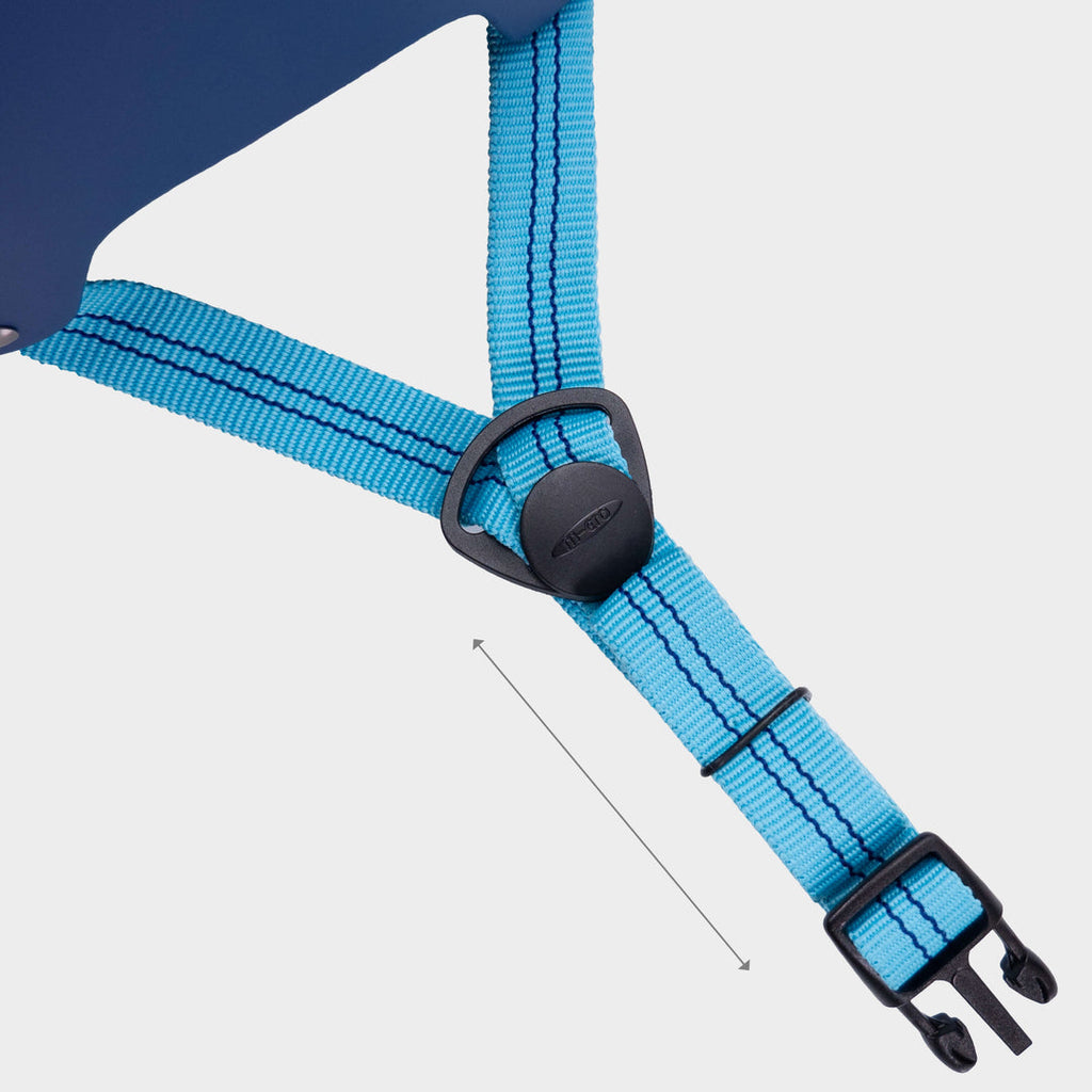 Close-up of the bright blue adjustable strap on the navy Micro helmet, with an arrow showing length adjustment