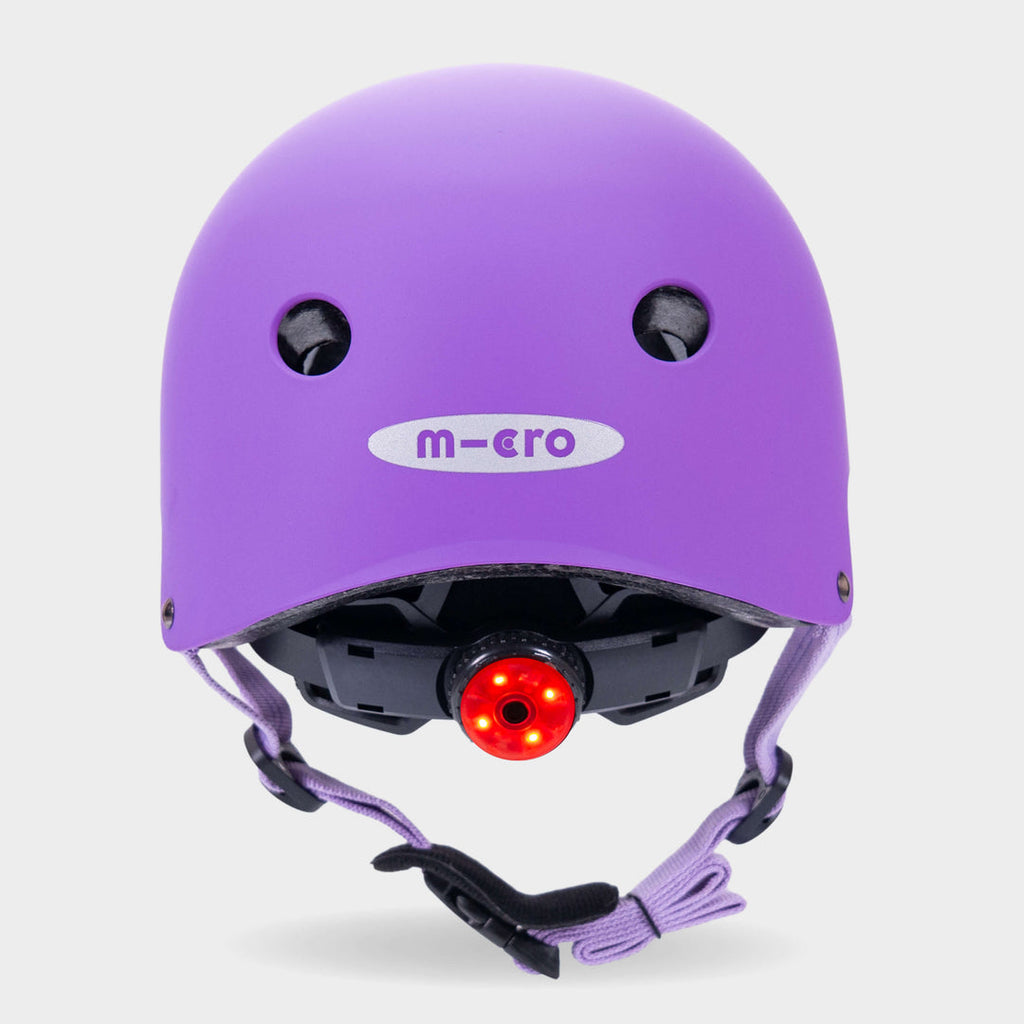 Back of the purple Micro plain helmet with the red rear safety light switched on