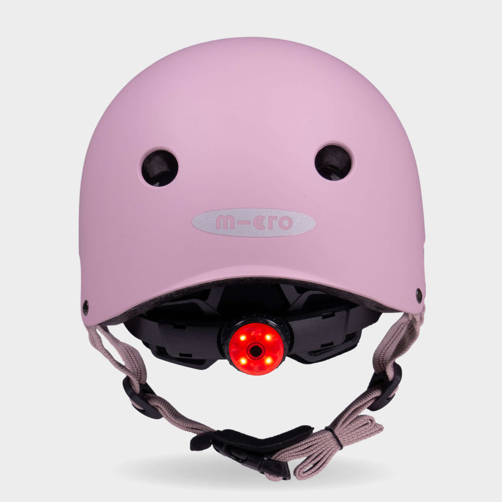 Back of the rose pink Micro plain helmet with the red rear safety light switched on