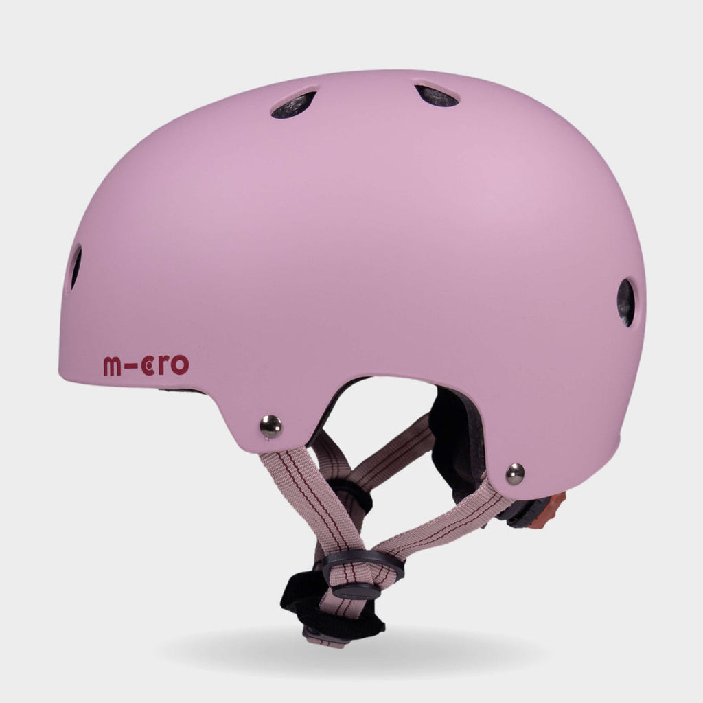 Side view of the rose pink Micro plain kids' helmet showing the air vents