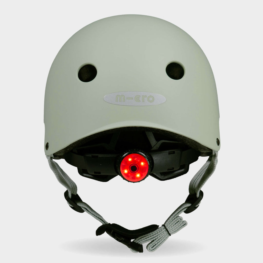 Back of the sage green Micro plain helmet with the red rear safety light switched on
