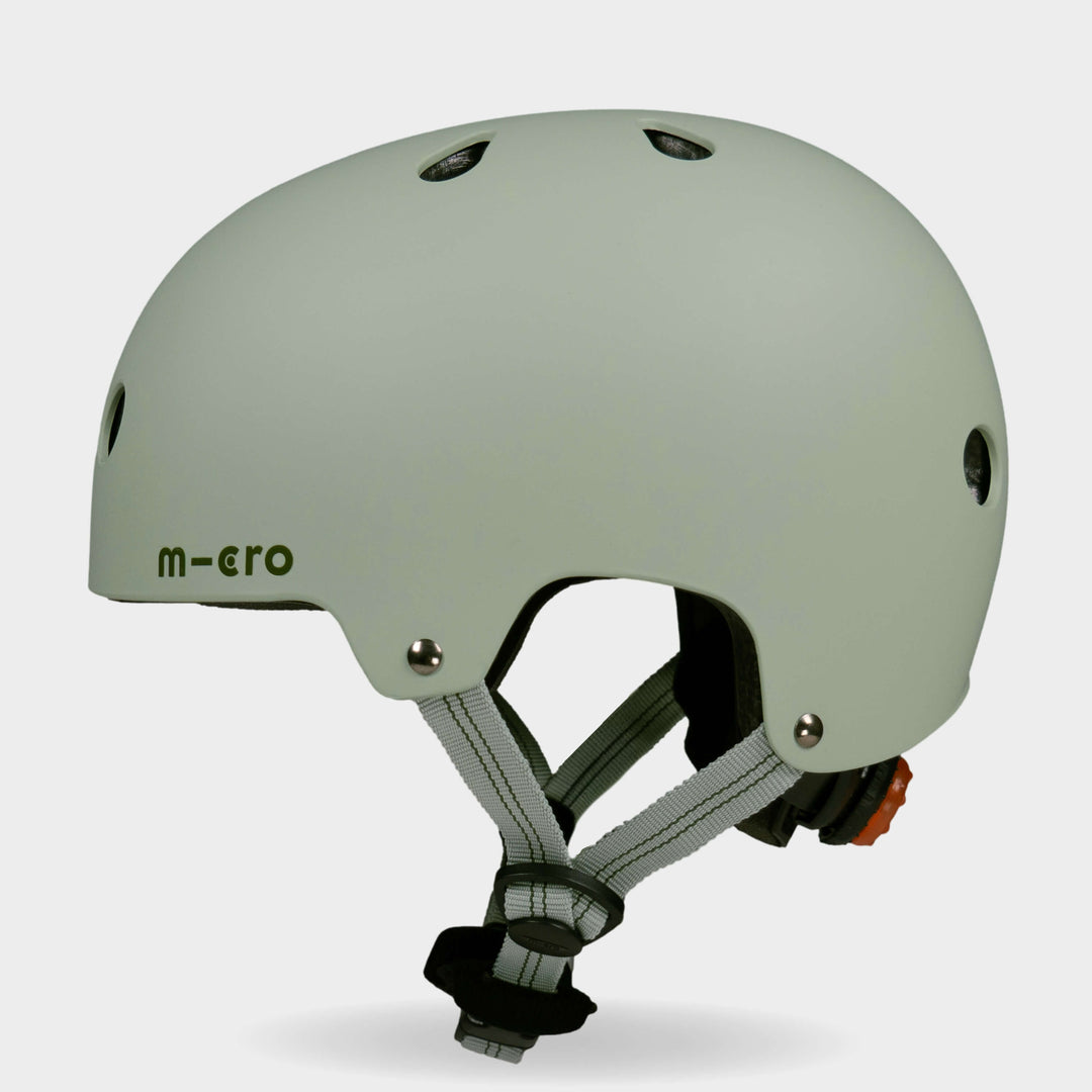 Side view of the sage green Micro plain kids' helmet showing the air vents