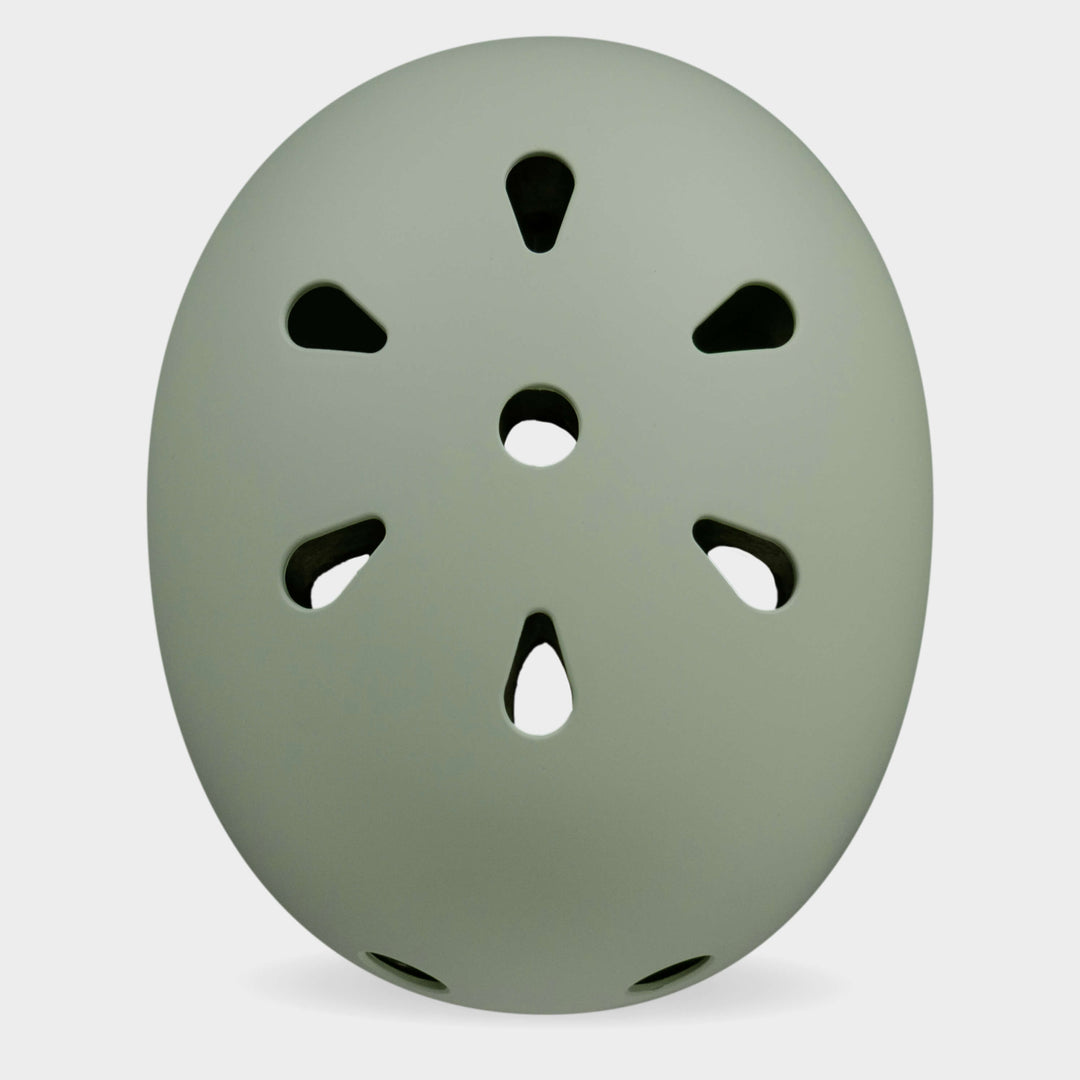 Top view of the sage green Micro plain helmet showing the air vents