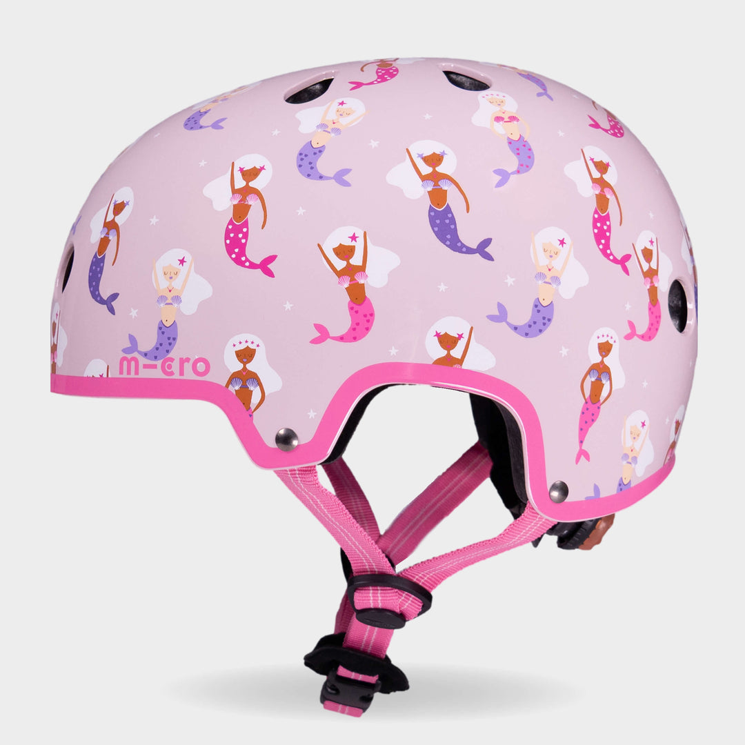 Side view of the Mermaid Micro kids' helmet with bright pink straps