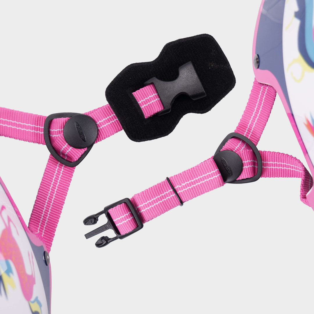 Close-up of the pink adjustable straps and black buckle on the Unicorn Micro helmet