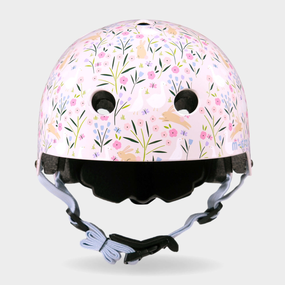 Front view of the Flora & Fauna Micro printed helmet with lilac straps