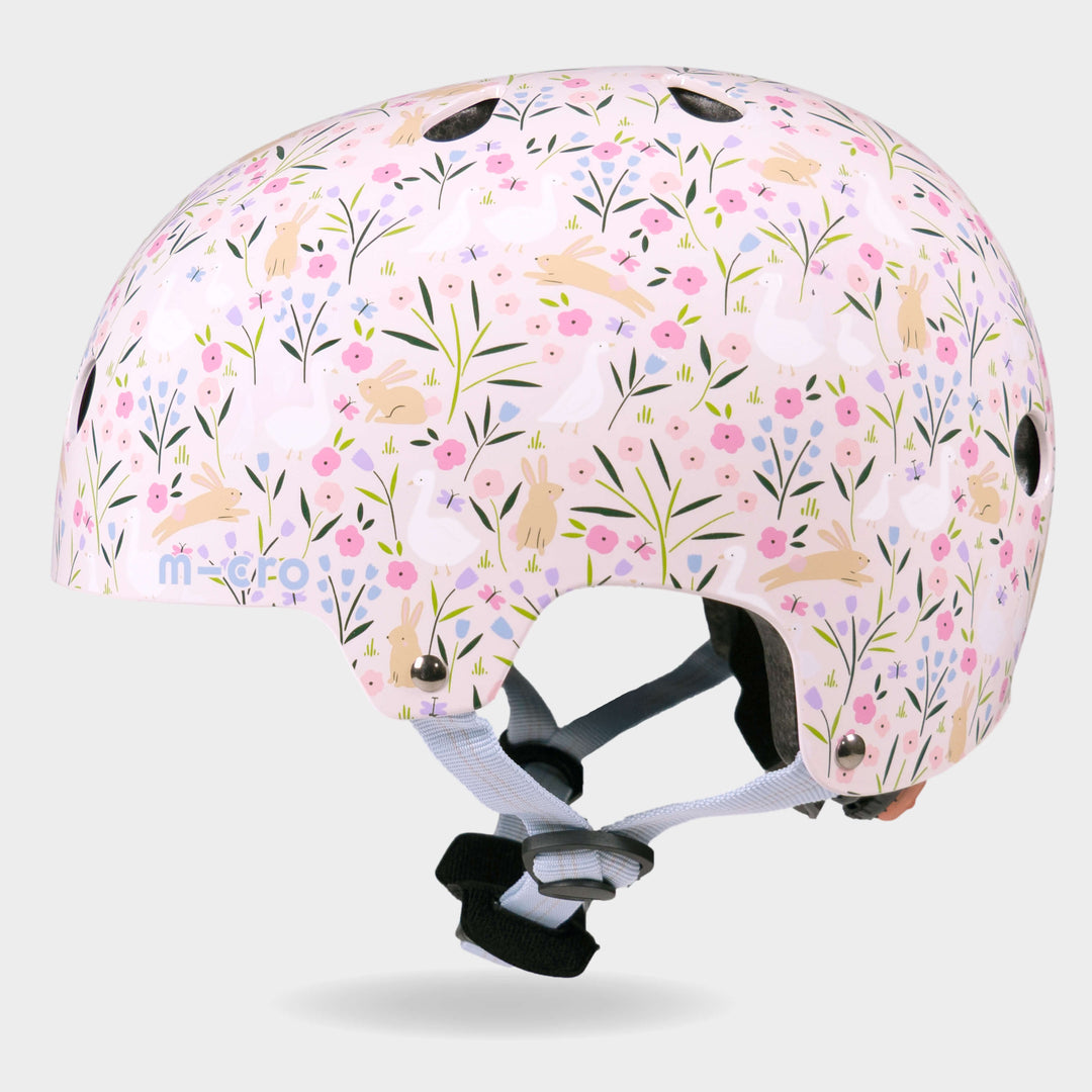 Side view of the Flora & Fauna Micro kids' helmet showing the floral print and air vents
