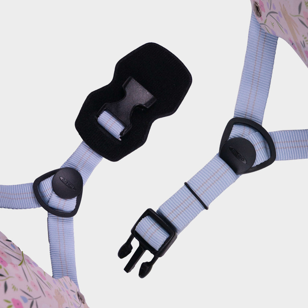 Close-up of the lilac adjustable straps and black buckle on the Flora & Fauna Micro helmet