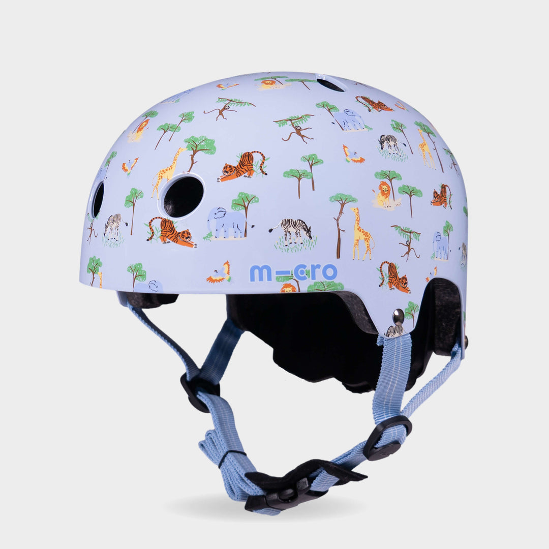 Micro printed helmet in pale blue with a safari animal pattern of lions, giraffes, elephants and trees, front three-quarter view