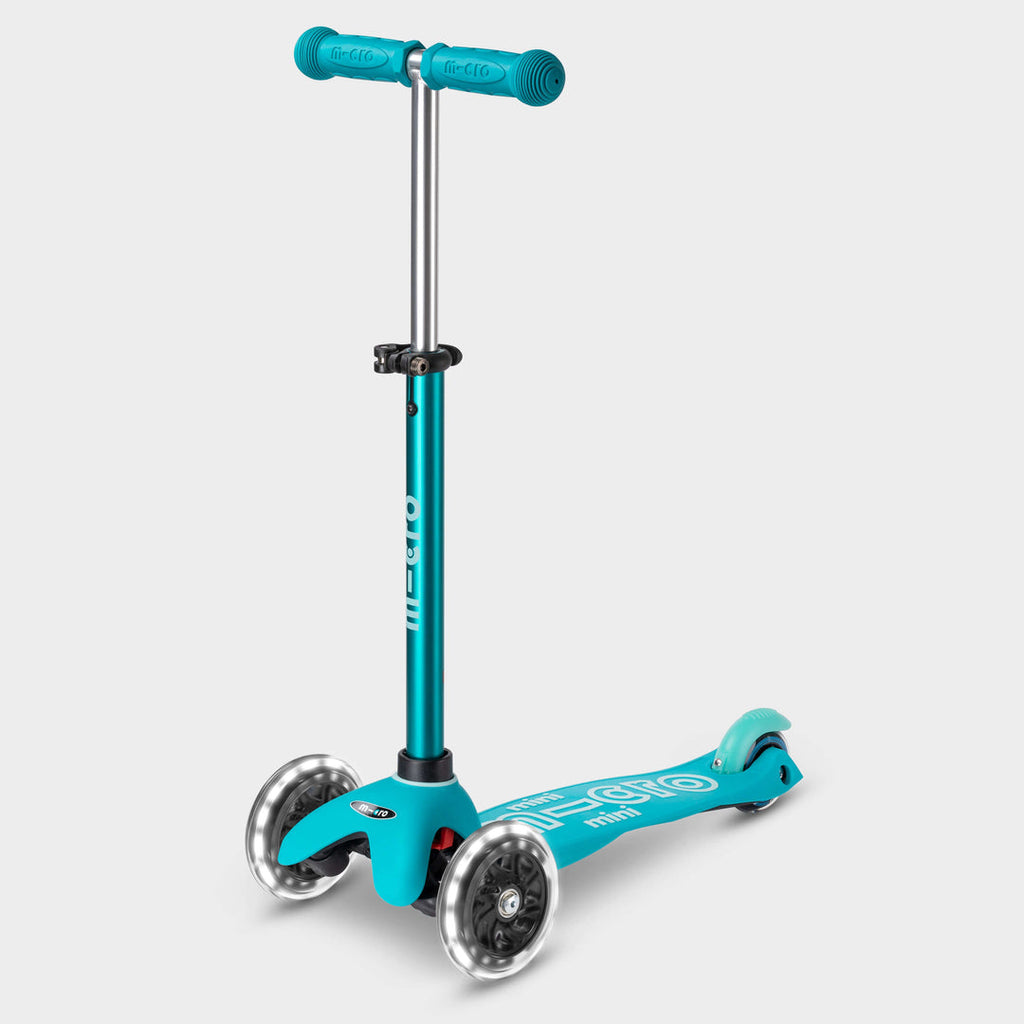 Mini Micro Deluxe LED three-wheel scooter in aqua with light-up wheels, side view