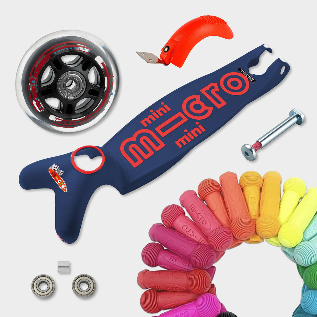 Replaceable parts for the navy Mini Micro Deluxe: spare wheel, deck, axle, bearings, brake and coloured grips