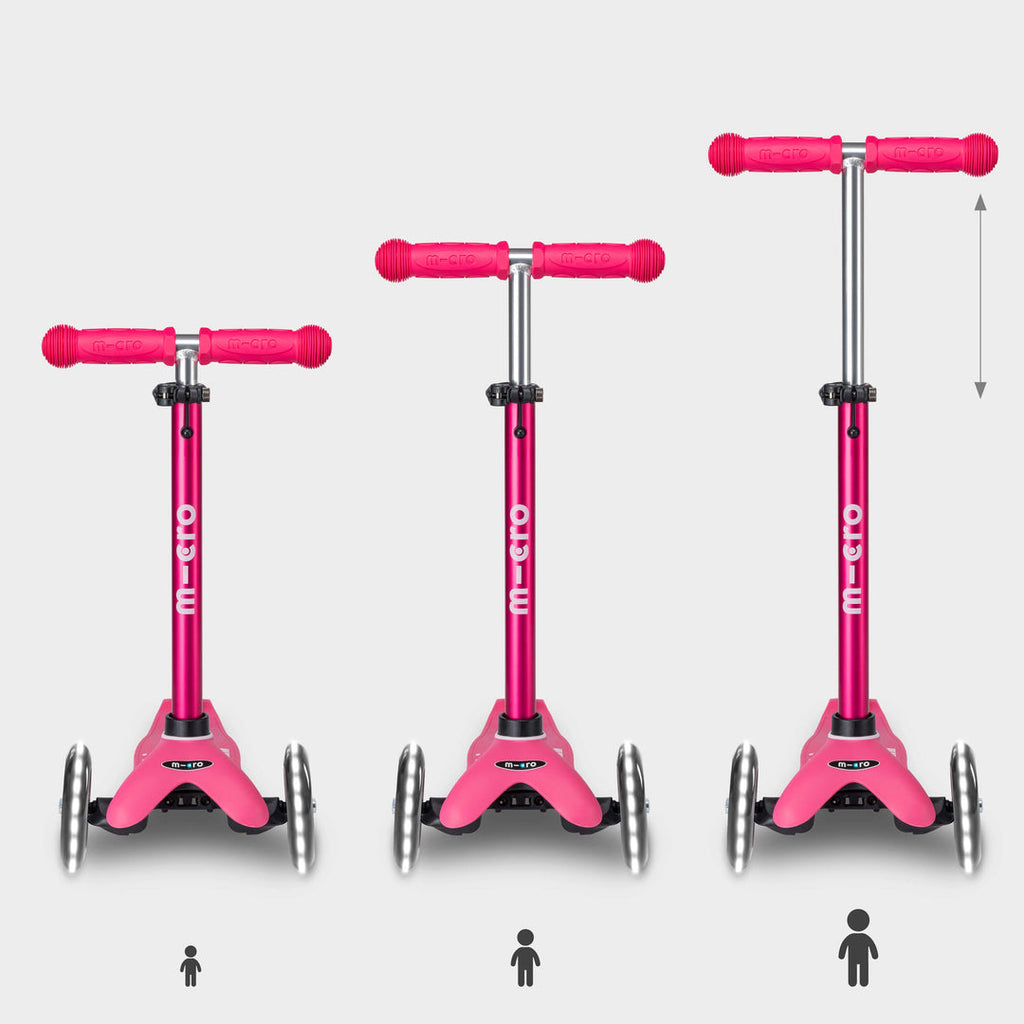 Three pink Mini Micro Deluxe LED scooters showing the handlebar height adjusting as a child grows