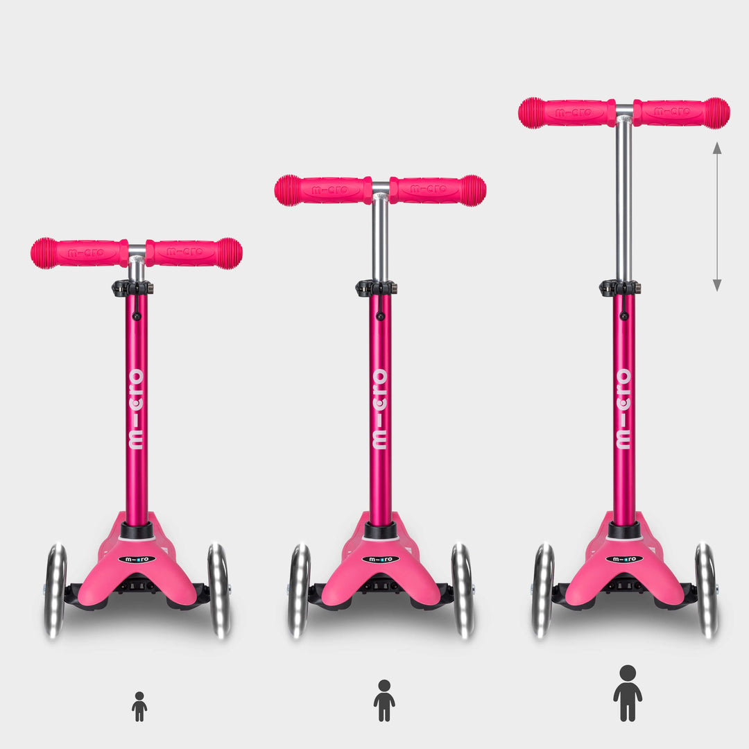 Three pink Mini Micro Deluxe LED scooters showing the handlebar height adjusting as a child grows