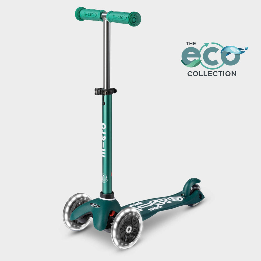 Mini Micro LED three-wheel scooter with recycled deck in dark green with light-up wheels, with the Eco Collection logo