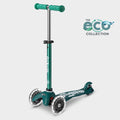 Mini Micro LED three-wheel scooter with recycled deck in dark green with light-up wheels, with the Eco Collection logo