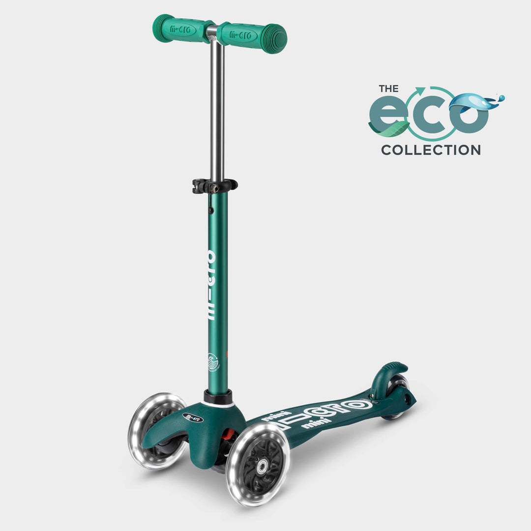Mini Micro LED three-wheel scooter with recycled deck in dark green with light-up wheels, with the Eco Collection logo