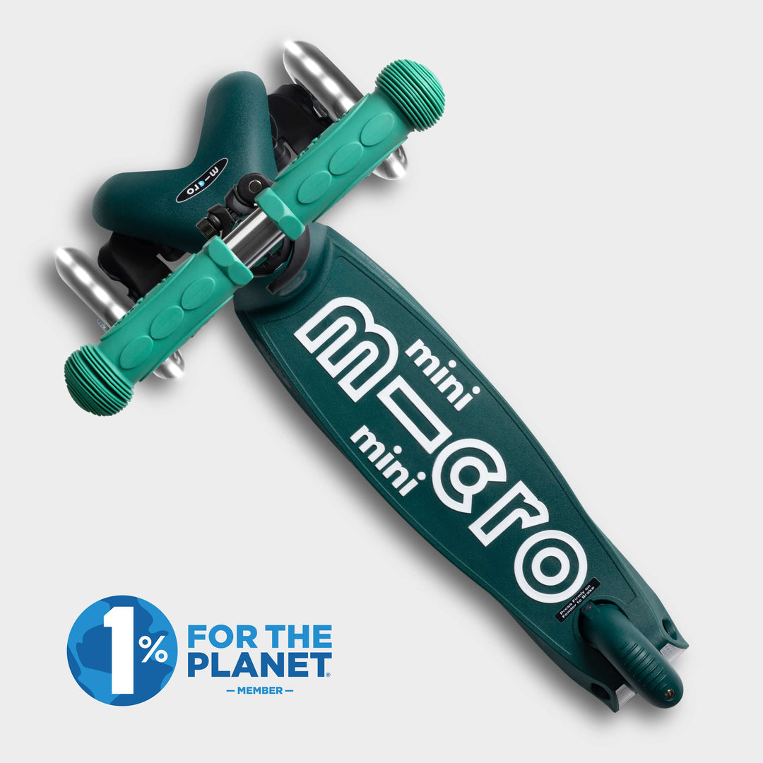 Top-down view of the green Mini Micro Eco deck with the mini micro logo and 1% for the Planet logo