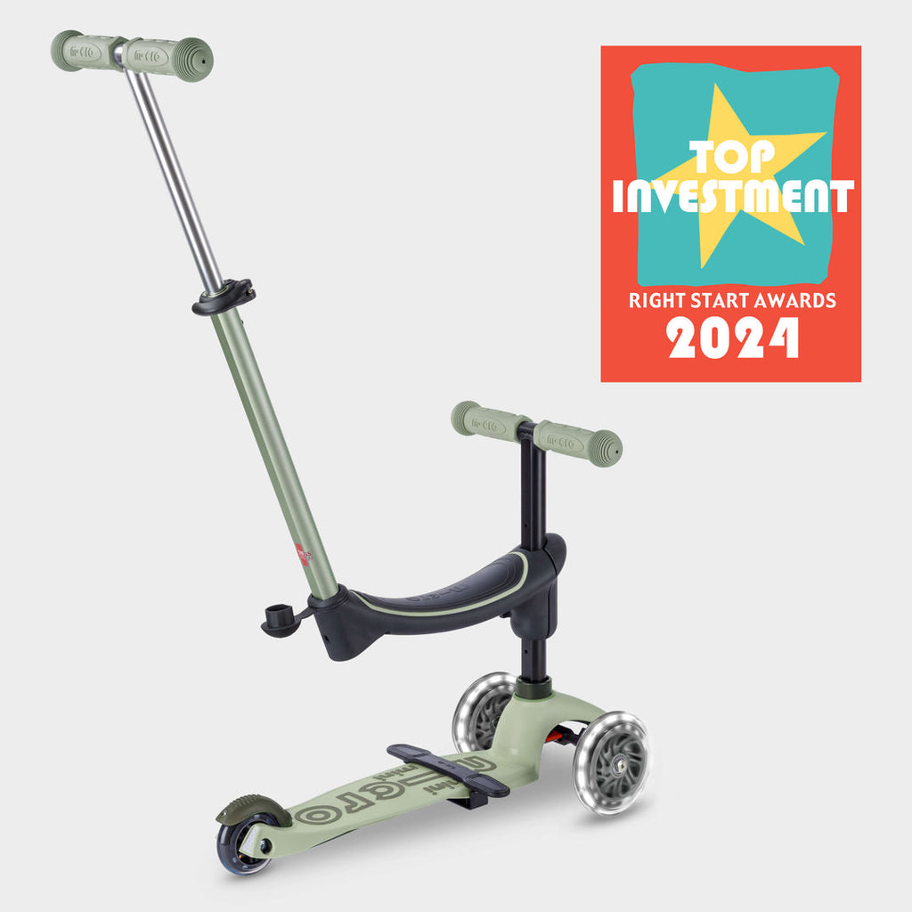 Sage green Micro Mini2Grow Deluxe ride-on with parent handle and the Right Start Top Investment 2024 award badge