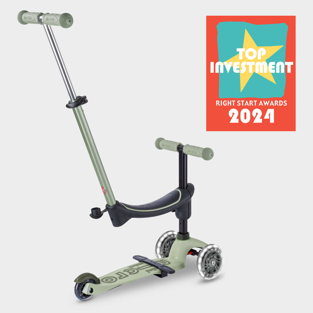 Sage green Micro Mini2Grow Deluxe ride-on with parent handle and the Right Start Top Investment 2024 award badge