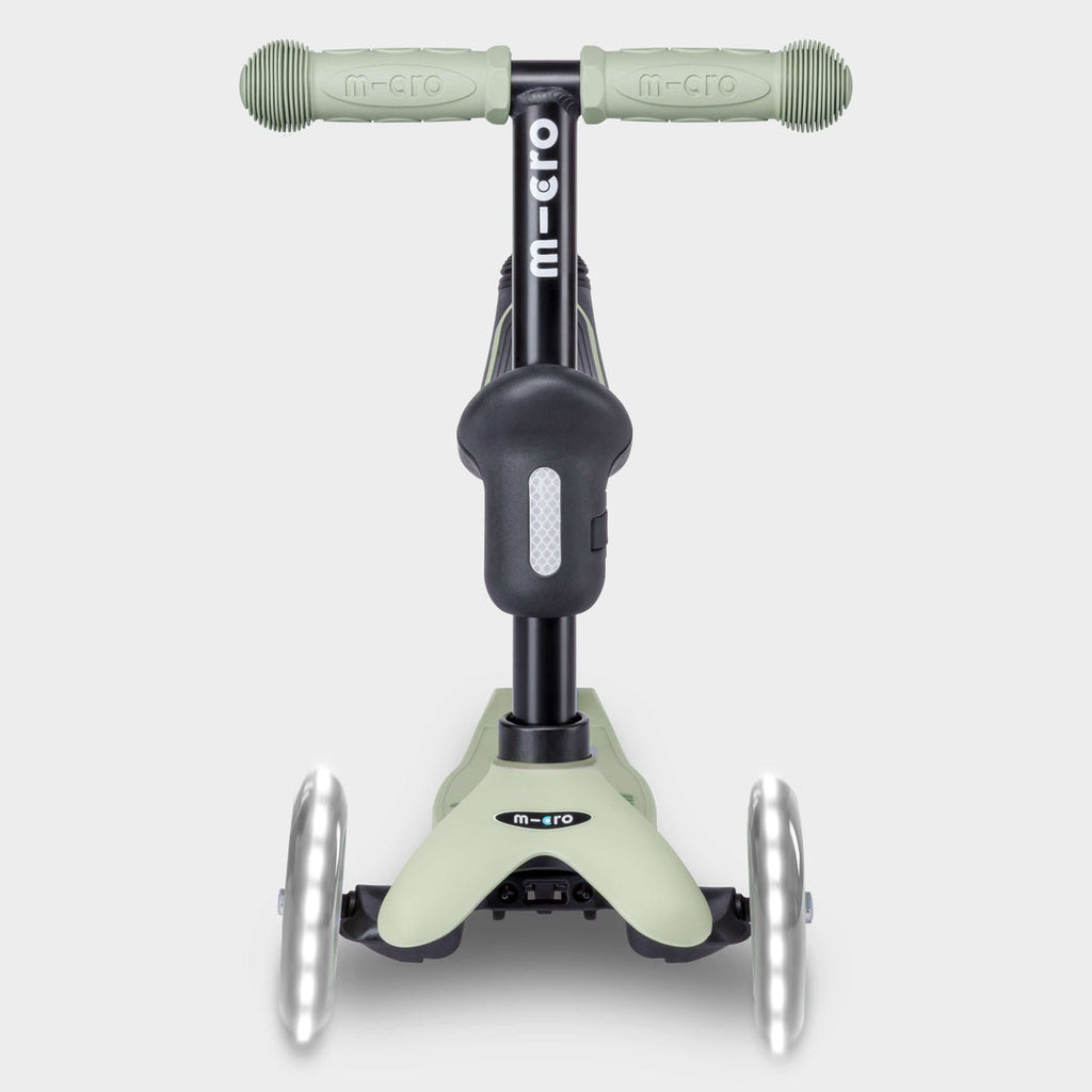 Front view of the sage green Micro Mini2Grow Deluxe scooter with light-up front wheels